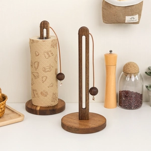 Set of two acacia wood paper towel holders with weighted beads and natural wood grain