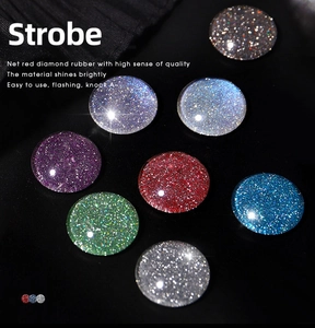 Macro detail of sparkly silver and multicolored diamond nail glitter gel cabochons
