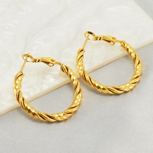 Elegant 18k gold-plated twisted rope hoop earrings displayed on a marble surface