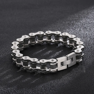 Detailed view of industrial style titanium steel motorcycle chain bracelet in silver grey
