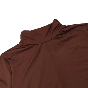 Close-up of the brown mock neck and soft pleated fabric on this slim fit long sleeve dress