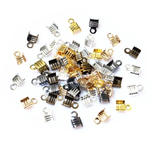 Assorted DIY jewelry cord ends and fold-over crimp clasps in multiple metallic colors
