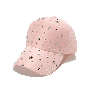 Pink baseball cap with silver metal stars and round rivets on high-quality fabric