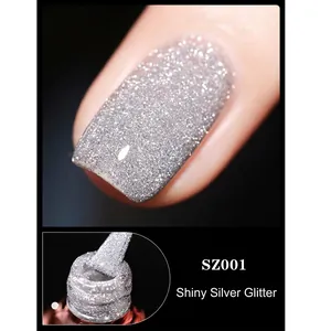 Macro detail of sparkly silver glitter nail polish with high shine reflective finish