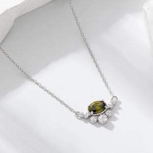 Elegant S925 sterling silver necklace with oval olive green zircon pendant on white stone
