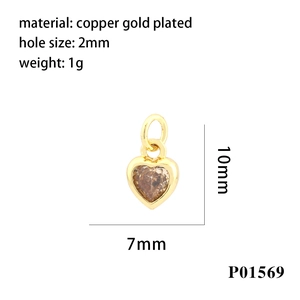 Detail of a 10mm gold-plated copper heart pendant with brown zircon for DIY jewelry