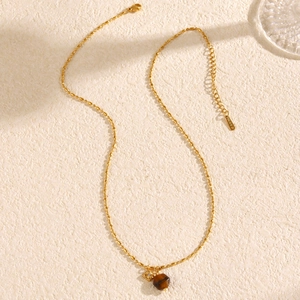 Minimalist gold necklace with brown tiger eye stone pendant and star charm for women