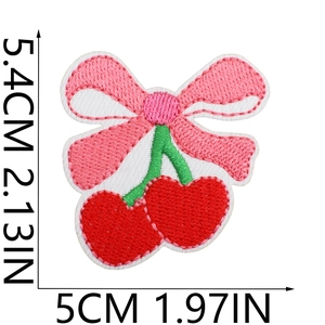 Embroidered pink bow patch with red cherry pattern measuring 5.4cm by 5cm for DIY decor