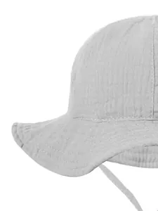 Detail of light gray baby cotton sun hat featuring breathable seersucker texture and chin strap