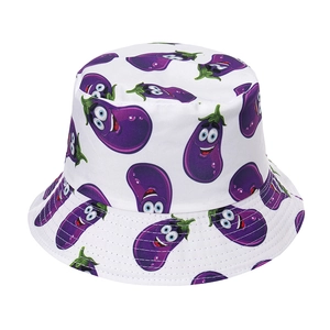 Detailed close-up of cartoon eggplant print on white twill cotton bucket hat fabric