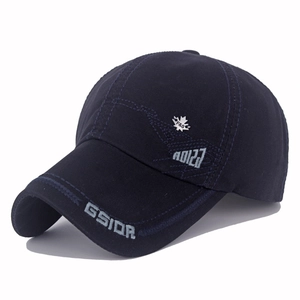 Detail of navy cotton baseball cap featuring GSIOR letter embroidery and silver maple leaf badge