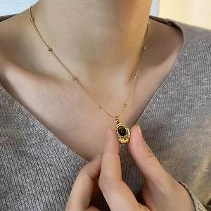 Collana da donna con pendente a goccia in occhio di tigre maillard in acciaio dorato