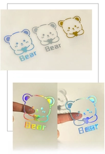 Holographic cartoon bear stickers showing rainbow color changes from different angles