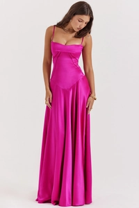 Close-up of the elegant V-shaped stitching and glossy satin texture on a magenta dress