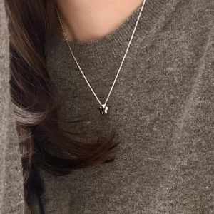Elegant 925 silver necklace with black and white butterfly pendant on a model