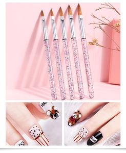 Detail of 5-piece nail art brushes with glitter acrylic handles and orange nylon bristles