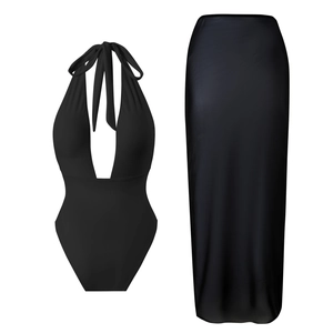 Detail view of black deep V-neck monokini paired with a sheer mesh split maxi skirt