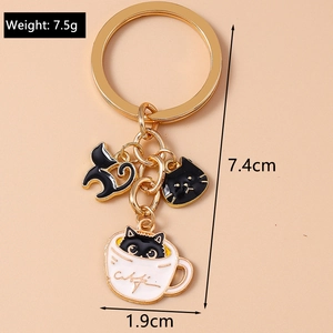 Detail view of cat charms keychain with dimensions 7.4cm and weight 7.5g