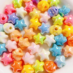 Macro shot of macaron star beads in assorted pastel colors for DIY jewelry making
