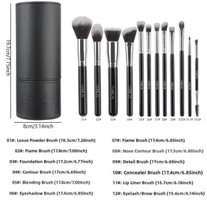 Detailed view of 12 professional makeup brushes with a black leather cylinder storage case