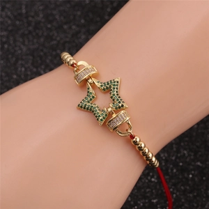 Bracelet étoile plaqué or avec zircon vert et cordon rouge pour femme