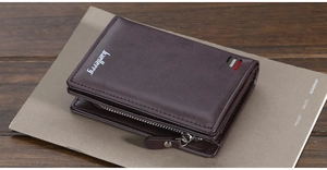 Detail of dark brown leather tri-fold wallet with zipper coin pocket on vintage notebook