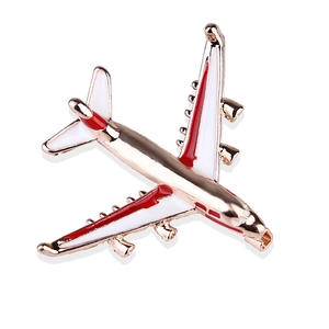 Elegant airplane enamel brooch in rose gold finish with red and white wing detailing