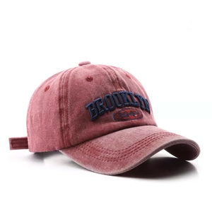 Distressed red cotton baseball cap featuring Brooklyn 1947 embroidery on white background