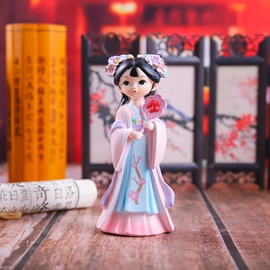 Detailed close-up of an ancient Chinese style girl figurine with floral fan and traditional dress