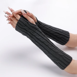 Detailed knit cable pattern on dark grey fingerless gloves for winter arm warmth