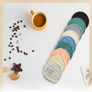 Detailed view of colorful non-slip silicone drink coasters in a stack for home table protection