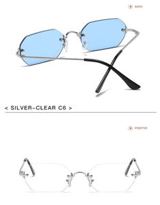 Detalle de gafas de sol hexagonales de metal plateado con cristales claros y corte recto