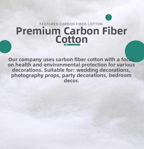 Close-up of white artificial snow cotton showing fluffy fiber texture for decor