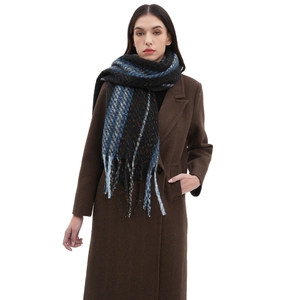 Blue and black plaid fringe scarf styled with a brown winter coat for women