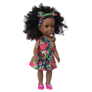 14-inch Black Reborn Baby Doll in floral blue dress and headband on white background