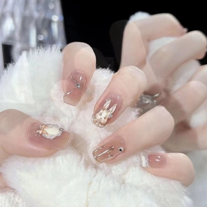 Handmade pink press-on nails with 3D rabbits, pearls, and liquid metal butterfly accents