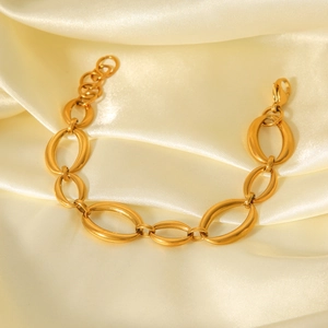 Minimalist 18K gold plated stainless steel oval link bracelet on champagne silk fabric