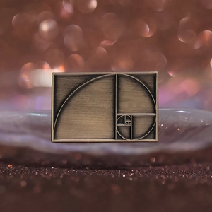 Vintage bronze Fibonacci spiral rectangle brooch pin with golden ratio geometric pattern