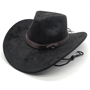 Detail of black cowboy hat with brown leather band, silver rivets, and chin strap