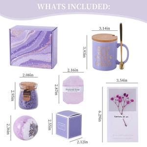 Detail view of purple tulip ceramic mug gift set with bath salt, soap, and flower card