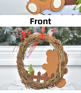 Detail of Christmas rattan wreath featuring felt bear, tree, and ribbon on a fireplace