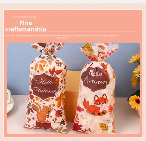 Detail of Hello Autumn gift bags featuring squirrel and fox prints with tie closures