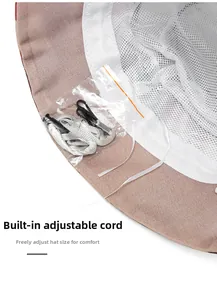 Close-up of breathable mesh lining and adjustable strap inside sun bucket hat