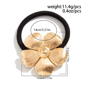 Detail showing dimensions of gold flower hair tie with weight 11.4g and 4.5cm floral size