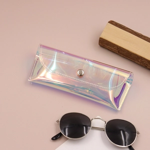 Detailed view of iridescent laser PVC sunglass pouch with metallic snap button closure