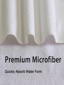 Close-up of premium white microfiber fabric showing soft texture and high water absorption