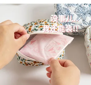Detailed shot showing storage space of a floral quilted cotton makeup bag with zipper