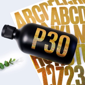 Detail of 2-inch gold glitter alphabet and number stickers on matte black bottle