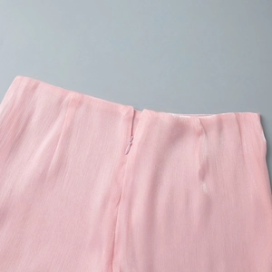 Detail of pink chiffon dress showing silk texture and invisible zipper closure