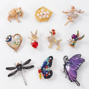 Assorted gold-plated animal and flower brooches with rhinestones and pearls